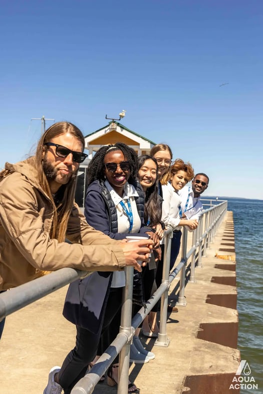 AquaHacking participants line up across pier