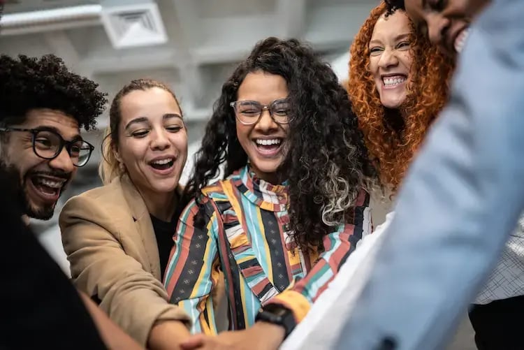 Group of happy colleagues in a team-building moment.