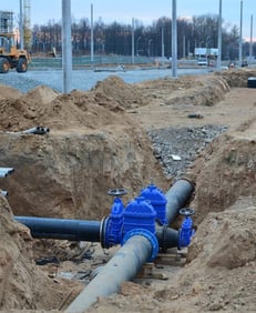 Installation of new water pipelines in an urban construction site.