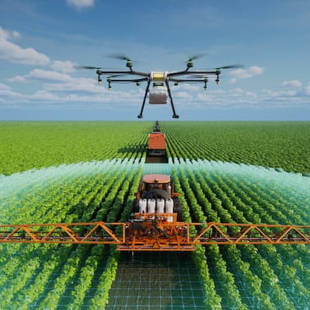 A drone flying over a large green field, assisting a tractor in precision irrigation, representing advanced agricultural technology and water efficiency. A drone flying over a large green field, assisting a tractor in precision irrigation, representing advanced agricultural technology and water efficiency.